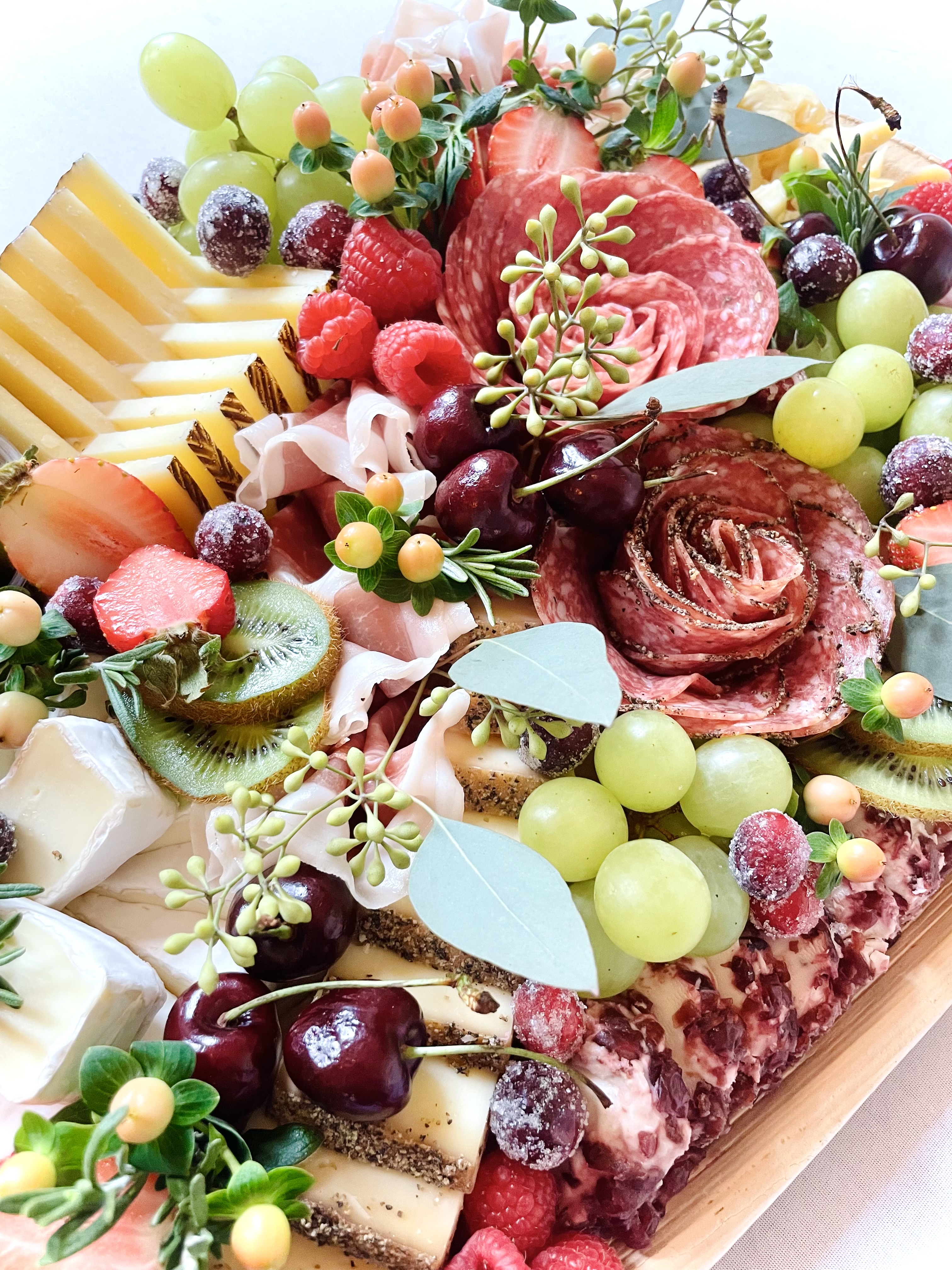 Holiday charcuterie board with cheeses, charcuterie, and seasonal garnishes by CharcuterieBrie, catering events throughout Chicago and the western suburbs including La Grange, Hinsdale, Oak Brook, and Western Springs.