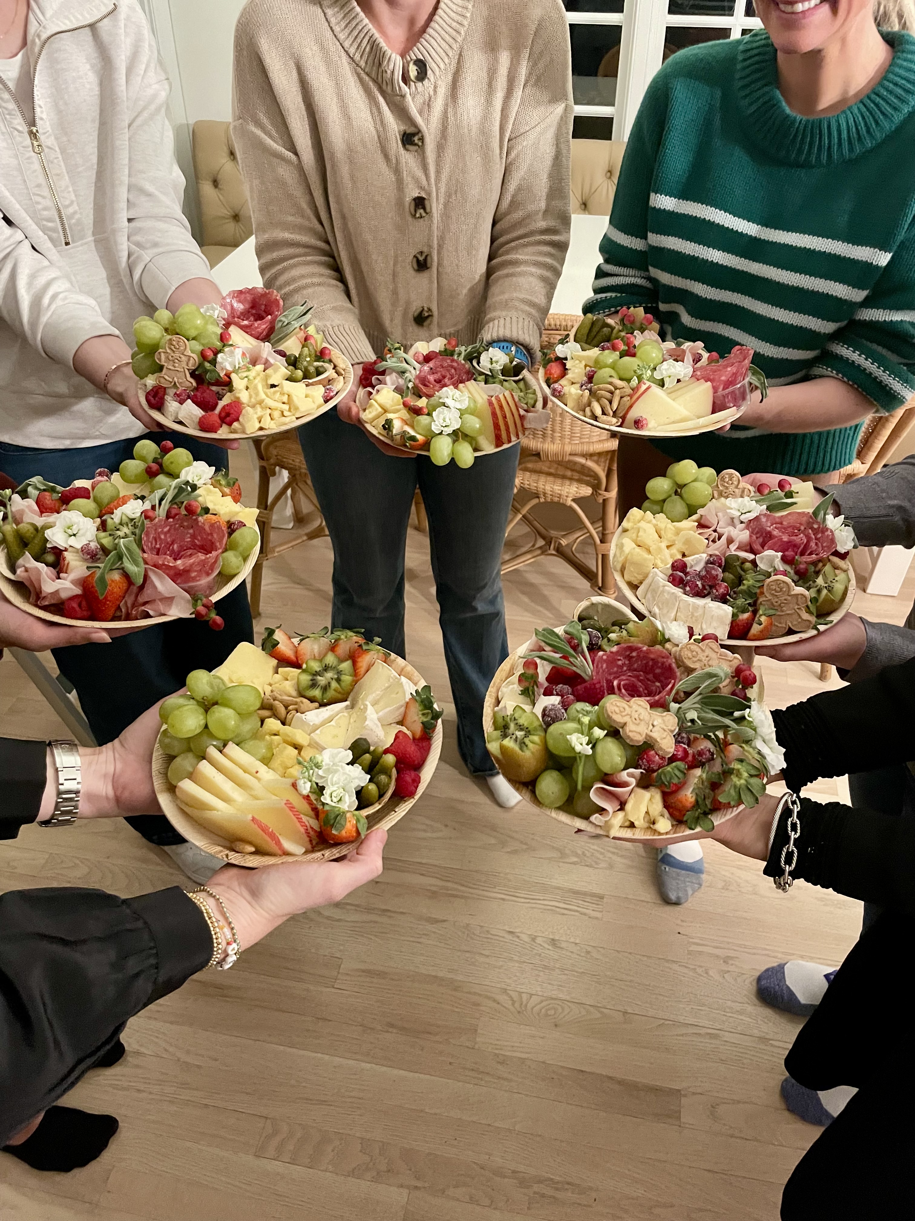 Charcuterie and grazing board workshop with fresh florals and greenery, hosted for groups in Hinsdale and the western Chicago suburbs